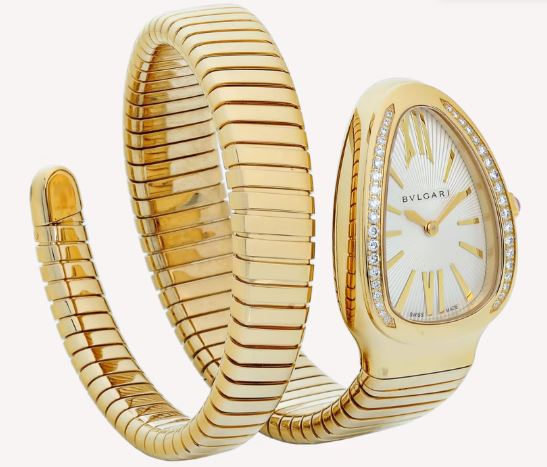 Bvlgari Serpenti watch with a white dial, stone-set gold-tone bezel, and coiled gold-tone wraparound bracelet.