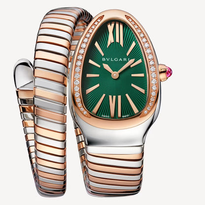 Bvlgari Serpenti watch with a green dial, stone-set rose gold-tone bezel, and a two-tone wraparound bracelet.