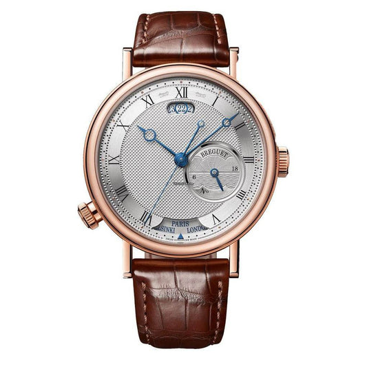 Breguet watch with a silver guilloché dial, blue hands, off-centre subdial, rose gold-tone case, and brown leather strap.