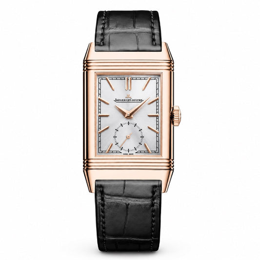 Jaeger-LeCoultre Reverso watch with a rose gold-tone rectangular case, silver dial, small seconds subdial, and black leather strap.