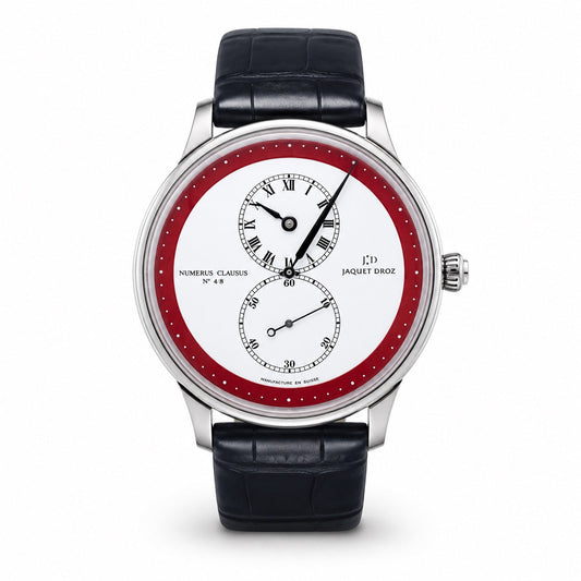 Jaquet Droz watch with a silver-tone case, white dial, red outer ring, off-center Roman numeral time display, small seconds subdial, and black leather strap.