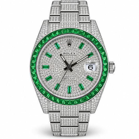 Rolex Datejust watch with a silver-tone metal bracelet and case fully paved with clear crystals, featuring a silver dial with crystal hour markers, a date window, and a vibrant green bezel set with green crystals.